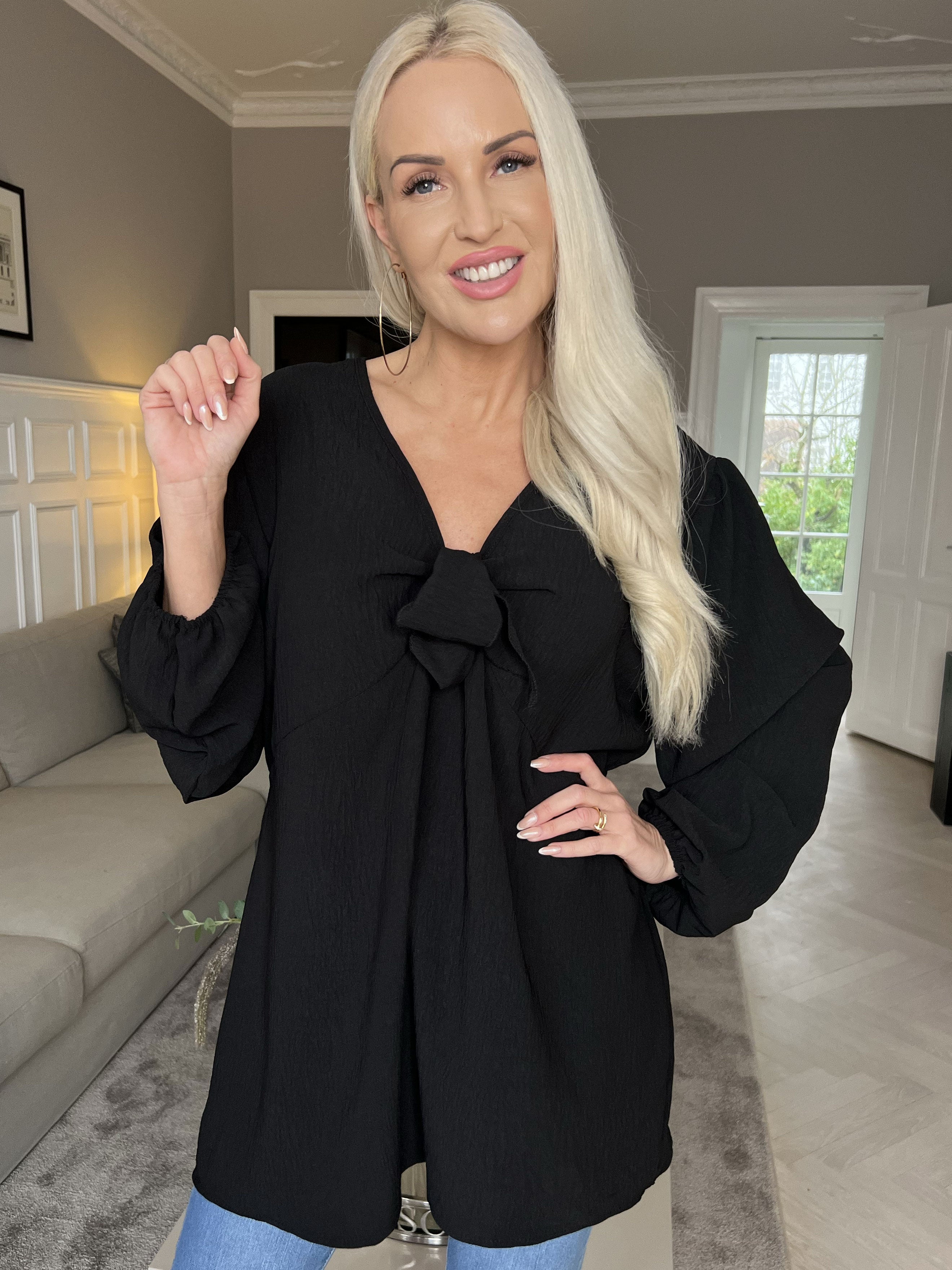 Cassandra - Söt tunika med rosett på bröstet